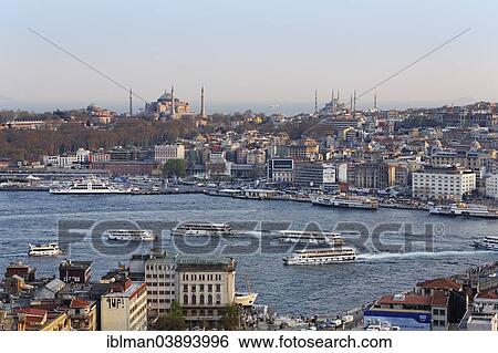 Stock Photograph - "Hagia Sophia and Sultan Ahmed Mosque or Blue Mosque, ferries, Golden Horn, view from Galata Tower, Istanbul, European side, Turkey, Asia". Fotosearch