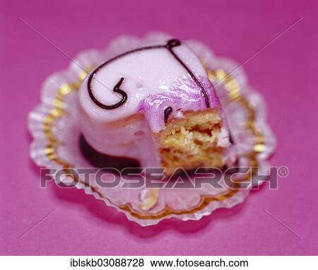 Half-eaten pink heart-shaped petit four View Large Photo Image Stock Photo - Half-eaten pink heart-shaped petit four. Fotosearch