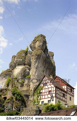 "Half-timbered house next towering karst rocks, Tuchersfeld, Pottenstein, Franconian Switzerland, Upper Franconia, Bavaria, Germany, Europe" View Large Photo Image Picture - "Half-timbered house next towering karst rocks, Tuchersfeld, Pottenstein, Franconian Switzerland, Upper Franconia, Bavaria, Germany, Europe". Fotosearch