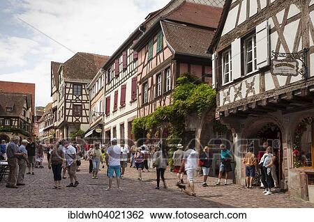 "Half-timbered houses and tourists in the Rue du General du Gaulle, Riquewihr, Alsace, France, Europe" View Large Photo Image Stock Image - "Half-timbered houses and tourists in the Rue du General du Gaulle, Riquewihr, Alsace, France, Europe". Fotosearch
