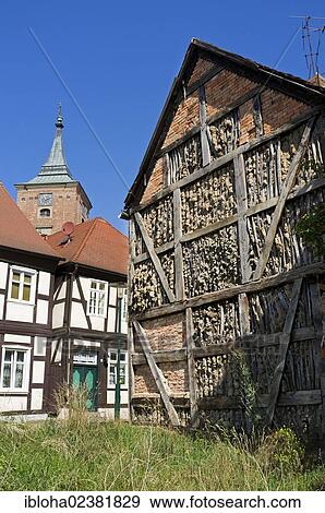 Stock Photo - "Half-timbered houses in front of the tower of St. Catherine's Church, Lenzen Elbe, Brandenburg, Germany, Europe". Fotosearch