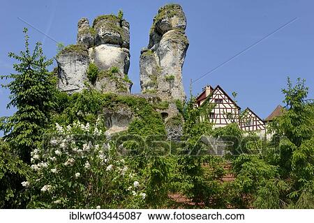 "Half-timbered houses next to towering karst rocks, Tuchersfeld, Pottenstein, Franconian Switzerland, Upper Franconia, Bavaria, Germany, Europe" View Large Photo Image Stock Photo - "Half-timbered houses next to towering karst rocks, Tuchersfeld, Pottenstein, Franconian Switzerland, Upper Franconia, Bavaria, Germany, Europe". Fotosearch