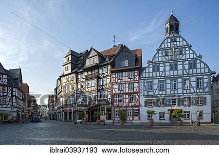 "Half-timbered houses with the former inn """"Zum Goldenen Lowen"""" with the Old Town Hall, market square, Butzbach, Hesse, Germany, Europe" View Large Photo Image Stock Image - "Half-timbered houses with the former inn """"Zum Goldenen Lowen"""" with the Old Town Hall, market square, Butzbach, Hesse, Germany, Europe". Fotosearch