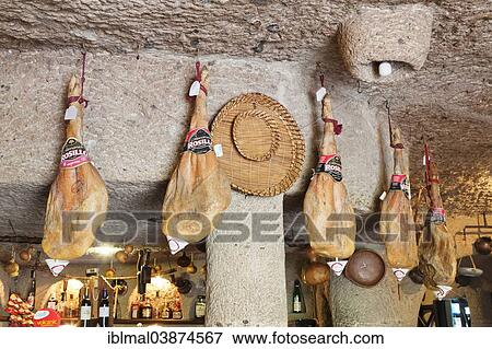 Stock Photo - "Ham hanging from the ceiling, Tagoror Restaurant, Barranco de Guayadeque, Gran Canaria, Canary Islands, Spain, Europe". Fotosearch