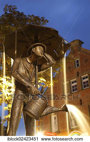 Hamballe fountain with a statue of a Hamballe, which denotes a lovable but foolish man in Hohenlohe, Poststrasse street, Oehringen, Hohenlohe, Baden-Wuerttemberg, Germany, Europe View Large Photo Image Stock Image - Hamballe fountain with a statue of a Hamballe, which denotes a lovable but foolish man in Hohenlohe, Poststrasse street, Oehringen, Hohenlohe, Baden-Wuerttemberg, Germany, Europe. Fotosearch