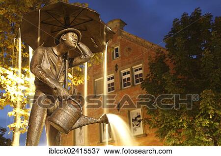 Hamballe Fountain with a statue of Hamballe, a term in Hohenlohe for a lovable but foolish man, Poststrasse Oehringen, Hohenlohe, Germany, Europe View Large Photo Image Stock Photo - Hamballe Fountain with a statue of Hamballe, a term in Hohenlohe for a lovable but foolish man, Poststrasse Oehringen, Hohenlohe, Germany, Europe. Fotosearch