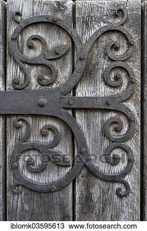 "Hand-forged iron works on a wooden door, Isny im Allgau, Allgau, Upper Swabia, Baden-Wurttemberg, Germany, Europe" View Large Photo Image Stock Image - "Hand-forged iron works on a wooden door, Isny im Allgau, Allgau, Upper Swabia, Baden-Wurttemberg, Germany, Europe". Fotosearch