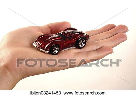 Hand holding a miniature car View Large Photo Image Stock Image - Hand holding a miniature car. Fotosearch