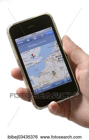 Stock Photograph - "Hand holding an Apple iPhone, France, Europe". Fotosearch