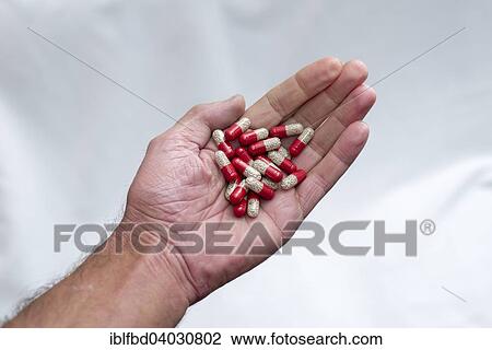 Hand holding capsules View Large Photo Image Stock Image - Hand holding capsules. Fotosearch