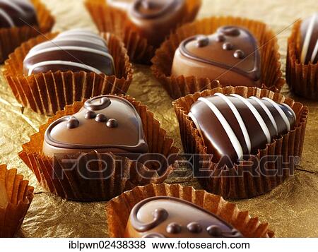 Stock Photo - Hand-made heart-shaped chocolates. Fotosearch