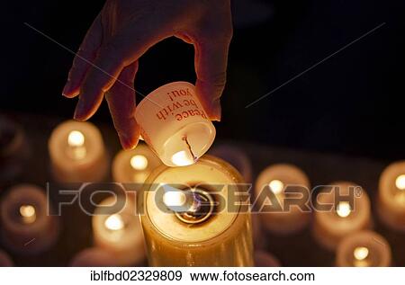 "Hand of a devotee lightening a candle for offering inside the Frauenkirche church, Dresden, Saxony, Germany, Europe" View Large Photo Image Stock Photo - "Hand of a devotee lightening a candle for offering inside the Frauenkirche church, Dresden, Saxony, Germany, Europe". Fotosearch