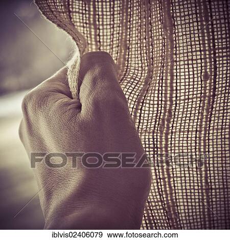 Hand opening or closing a curtain View Large Photo Image Stock Photo - Hand opening or closing a curtain. Fotosearch