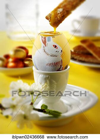 Hand painted egg with traditional Easter design being eaten for breakfast View Large Photo Image Stock Photo - Hand painted egg with traditional Easter design being eaten for breakfast. Fotosearch