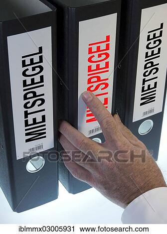 "Hand pointing to a file folder labeled """"Mietspiegel"""", German for """"rent index""""" View Large Photo Image Stock Image - "Hand pointing to a file folder labeled """"Mietspiegel"""", German for """"rent index""""". Fotosearch