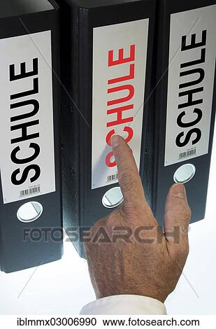 "Hand pointing to a file folder labeled """"Schule"""", German for """"school""""" View Large Photo Image Stock Image - "Hand pointing to a file folder labeled """"Schule"""", German for """"school""""". Fotosearch