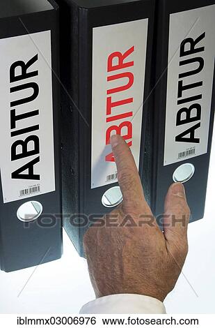 "Hand pointing to a file folder labeled """"Abitur"""", German for """"A level""""" View Large Photo Image Stock Photograph - "Hand pointing to a file folder labeled """"Abitur"""", German for """"A level""""". Fotosearch