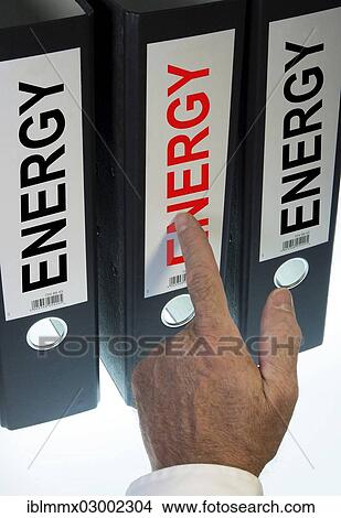 "Hand pointing to a ring binder labeled Energy, symbolic image" View Large Photo Image Picture - "Hand pointing to a ring binder labeled Energy, symbolic image". Fotosearch