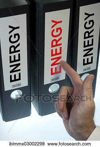"Hand pointing to a ring binder labeled Energy, symbolic image" View Large Photo Image Stock Photo - "Hand pointing to a ring binder labeled Energy, symbolic image". Fotosearch