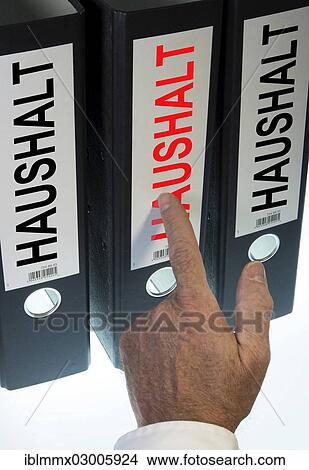 "Hand pointing to a ring binder labelled """"HAUSHALT"""", German for """"household""""" View Large Photo Image Picture - "Hand pointing to a ring binder labelled """"HAUSHALT"""", German for """"household""""". Fotosearch