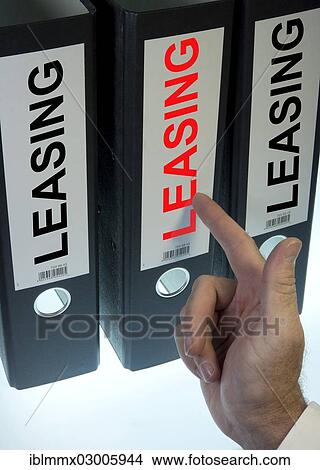 "Hand pointing to a ring binder labelled """"LEASING""""" View Large Photo Image Picture - "Hand pointing to a ring binder labelled """"LEASING""""". Fotosearch