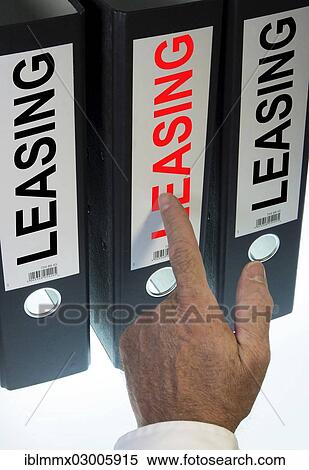 "Hand pointing to a ring binder labelled """"LEASING""""" View Large Photo Image Stock Photography - "Hand pointing to a ring binder labelled """"LEASING""""". Fotosearch