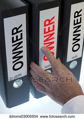 Hand reaching for a file folder labeled " Owner" View Large Photo Image Picture - Hand reaching for a file folder labeled " Owner". Fotosearch