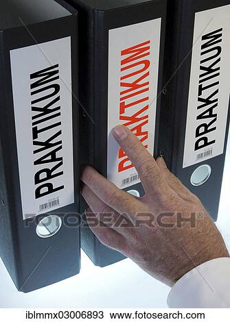 Stock Image - "Hand reaching for a file folder labeled """"Praktikum"""", German for """"internship""""". Fotosearch