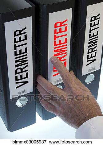 "Hand reaching for a file folder labeled """"Vermieter"""", German for """"Landlord""""" View Large Photo Image Stock Photo - "Hand reaching for a file folder labeled """"Vermieter"""", German for """"Landlord""""". Fotosearch