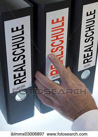 "Hand reaching for a file folder labeled """"Realschule"""", German for """"middle school""""" View Large Photo Image Stock Photo - "Hand reaching for a file folder labeled """"Realschule"""", German for """"middle school""""". Fotosearch
