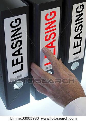 "Hand reaching for a ring binder labelled """"LEASING""""" View Large Photo Image Stock Image - "Hand reaching for a ring binder labelled """"LEASING""""". Fotosearch