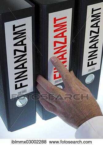 "Hand reaching for file folders labeled """"Finanzamt"""", German for """"tax office""""" View Large Photo Image Stock Photo - "Hand reaching for file folders labeled """"Finanzamt"""", German for """"tax office""""". Fotosearch