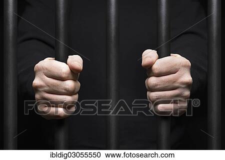 Hands of prisoner around prison bars View Large Photo Image Stock Image - Hands of prisoner around prison bars. Fotosearch