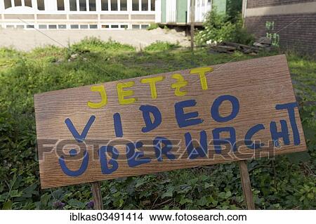 "Handwritten sign """"jetzt videoueberwacht"""", German for """"now under video surveillance"""", outside an abandoned building complex, Innenhafen, Duisburg, Ruhr district, North Rhine-Westphalia, Germany, Europe" View Large Photo Image Picture - "Handwritten sign """"jetzt videoueberwacht"""", German for """"now under video surveillance"""", outside an abandoned building complex, Innenhafen, Duisburg, Ruhr district, North Rhine-Westphalia, Germany, Europe". Fotosearch