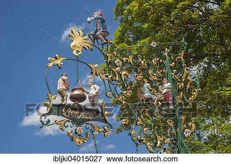 "Hanging shop sign, Bergsee restaurant, Titisee-Neustadt, Black Forest, Baden-Wurttemberg, Germany, Europe" View Large Photo Image Stock Photo - "Hanging shop sign, Bergsee restaurant, Titisee-Neustadt, Black Forest, Baden-Wurttemberg, Germany, Europe". Fotosearch