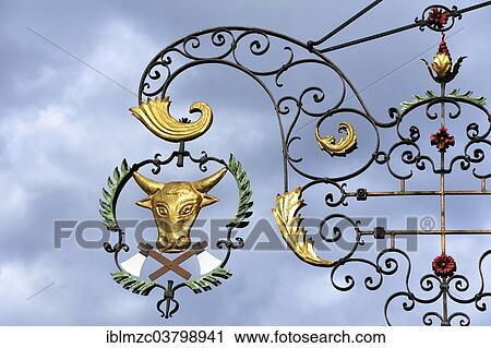 "Hanging sign at a butcher's against grey cloudy sky, Bad Windsheim, Middle Franconia, Bavaria, Germany, Europe" View Large Photo Image Stock Image - "Hanging sign at a butcher's against grey cloudy sky, Bad Windsheim, Middle Franconia, Bavaria, Germany, Europe". Fotosearch
