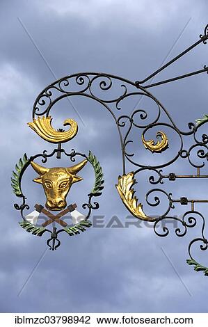 "Hanging sign at a butcher's against grey cloudy sky, Bad Windsheim, Middle Franconia, Bavaria, Germany, Europe" View Large Photo Image Stock Image - "Hanging sign at a butcher's against grey cloudy sky, Bad Windsheim, Middle Franconia, Bavaria, Germany, Europe". Fotosearch