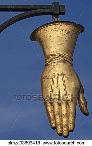 "Hanging sign, golden glove of a former glove factory, Erlangen, Middle Franconia, Bavaria, Germany, Europe" View Large Photo Image Stock Photo - "Hanging sign, golden glove of a former glove factory, Erlangen, Middle Franconia, Bavaria, Germany, Europe". Fotosearch