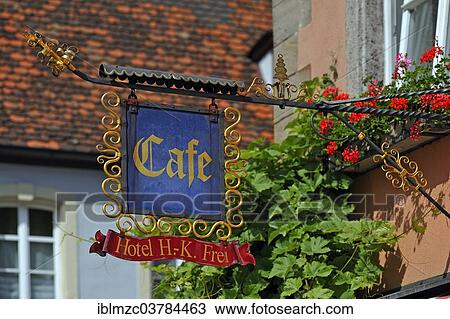 Stock Image - "Hanging sign of a cafe, Rothenburg ob der Tauber, Middle Franconia, Bavaria, Germany, Europe". Fotosearch