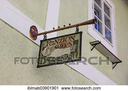 "Hanging sign of a guesthouse, Penzion Cortes Hudebniny, Cesky Krumlov, Jihocesky kraj, South Bohemia, Czech Republic, Europe" View Large Photo Image Stock Image - "Hanging sign of a guesthouse, Penzion Cortes Hudebniny, Cesky Krumlov, Jihocesky kraj, South Bohemia, Czech Republic, Europe". Fotosearch