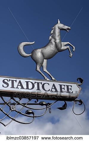 "Hanging sign of """"Stadtcafe"""" against a blue sky, Lindenberg, Allgau, Bavaria, Germany, Europe" View Large Photo Image Stock Photo - "Hanging sign of """"Stadtcafe"""" against a blue sky, Lindenberg, Allgau, Bavaria, Germany, Europe". Fotosearch