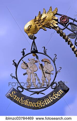 "Hanging sign of the restaurant """"Landsknechtstubchen"""", Rothenburg ob der Tauber, Middle Franconia, Bavaria, Germany, Europe" View Large Photo Image Stock Photo - "Hanging sign of the restaurant """"Landsknechtstubchen"""", Rothenburg ob der Tauber, Middle Franconia, Bavaria, Germany, Europe". Fotosearch