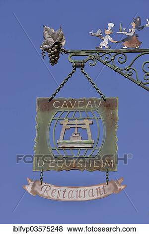 "Hanging sign on an Alsatian restaurant, Eguisheim, Departement Haut-Rhin, Alsace, France, Europe" View Large Photo Image Stock Photo - "Hanging sign on an Alsatian restaurant, Eguisheim, Departement Haut-Rhin, Alsace, France, Europe". Fotosearch