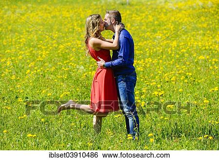 "Happy lovers kissing on a flower meadow in the spring, Tyrol, Austria, Europe" View Large Photo Image Stock Photograph - "Happy lovers kissing on a flower meadow in the spring, Tyrol, Austria, Europe". Fotosearch