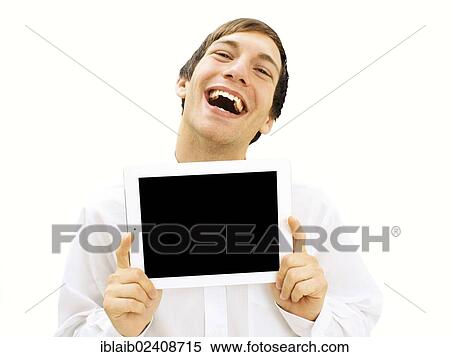 Stock Photography - Happy man holding an iPad. Fotosearch
