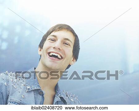 Stock Image - "Happy young man, portrait". Fotosearch