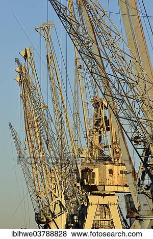 "Harbor cranes for cargo handling in the harbour museum, Hamburg, Germany, Europe" View Large Photo Image Stock Photo - "Harbor cranes for cargo handling in the harbour museum, Hamburg, Germany, Europe". Fotosearch