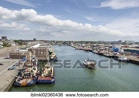 "Harbor of Ijmuiden with moored fishing boats or trawlers and tugboats, North Holland, the Netherlands, Europe" View Large Photo Image Stock Photograph - "Harbor of Ijmuiden with moored fishing boats or trawlers and tugboats, North Holland, the Netherlands, Europe". Fotosearch