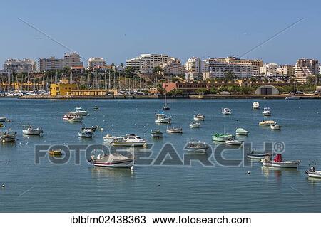 "Harbor, view of Portimao as seen from Ferragudo, Algarve, Portugal, Europe" View Large Photo Image Stock Image - "Harbor, view of Portimao as seen from Ferragudo, Algarve, Portugal, Europe". Fotosearch