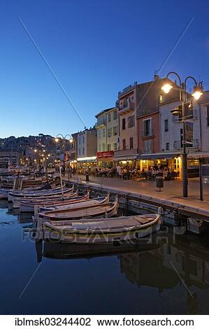 "Harbour and historic town centre, small fishing boats, street cafes and restaurants, evening mood, Cassis, Departement Bouches-du-Rhone, Region Provence-Alpes-Cote d’Azur d’Azur, France, Europe" View Large Photo Image Stock Image - "Harbour and historic town centre, small fishing boats, street cafes and restaurants, evening mood, Cassis, Departement Bouches-du-Rhone, Region Provence-Alpes-Cote d’Azur d’Azur, France, Europe". Fotosearch